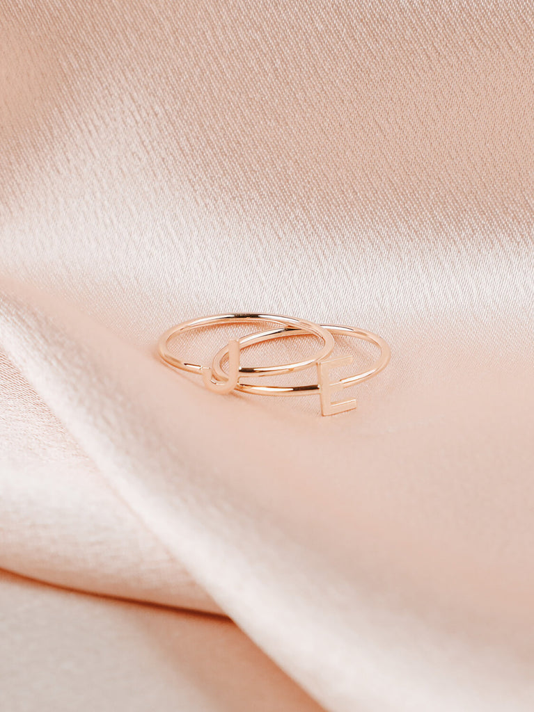 detail photo of women's "J" and "L" Block initial ring in 14k yellow gold