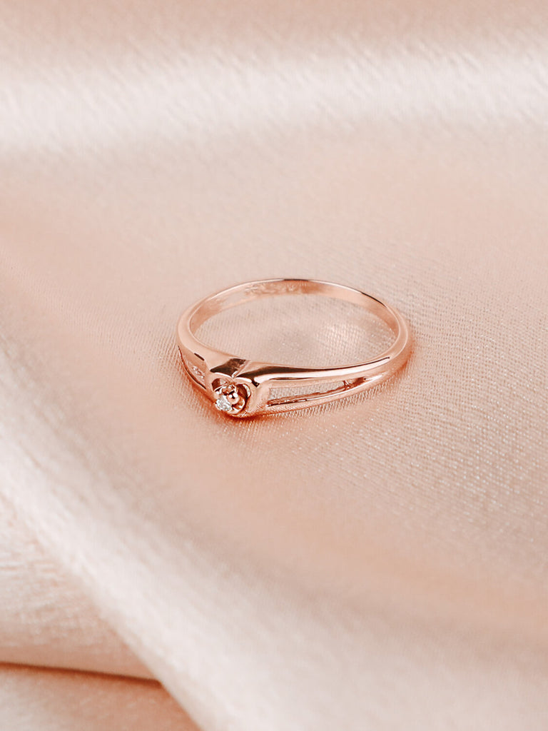 close up detail shot of diamond heart promise ring in 14k rose gold
