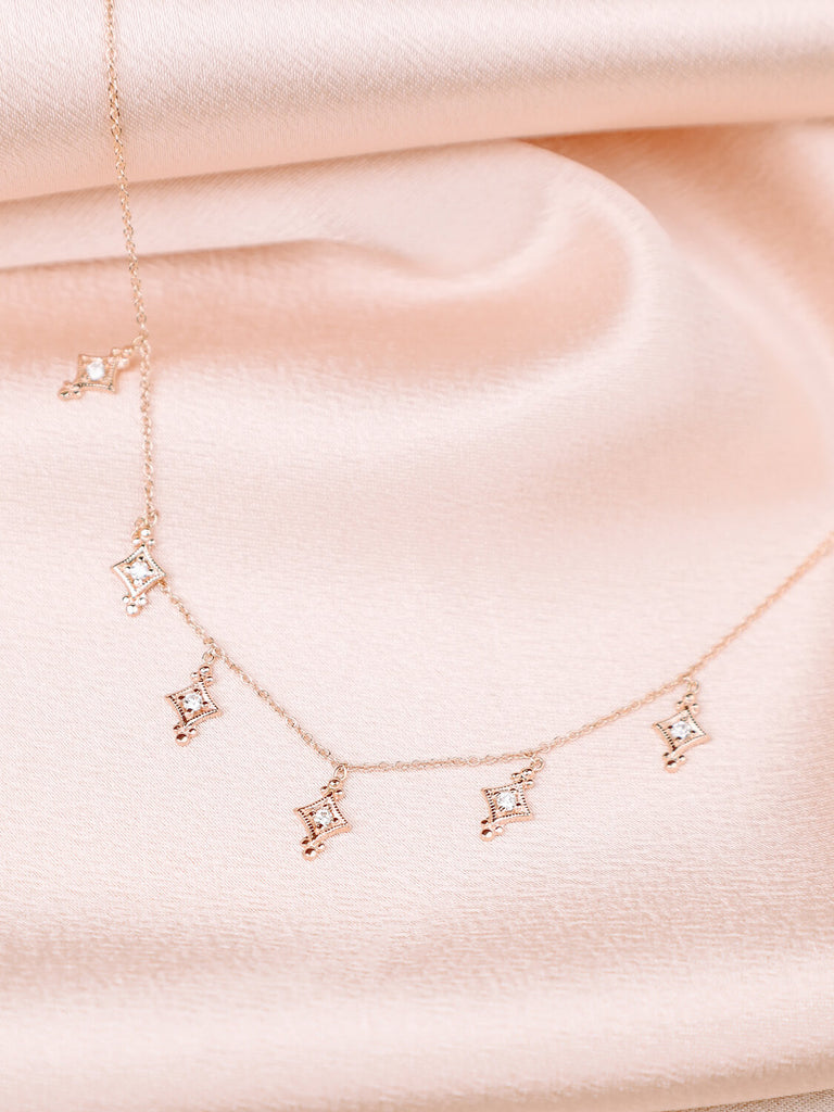 photo of evening star necklace with diamonds in 14k yellow gold