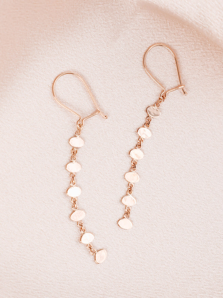 detail product photo of mermaid beauty oval earrings in yellow gold laying down