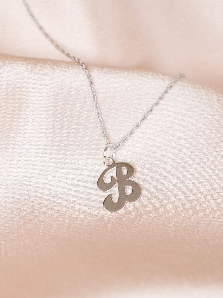 close up photo Sterling silver "B" pendant necklace on chain