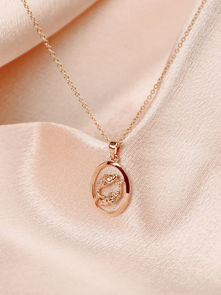 detail photo of pisces zodiac charm necklace in 14k yellow gold with diamonds 