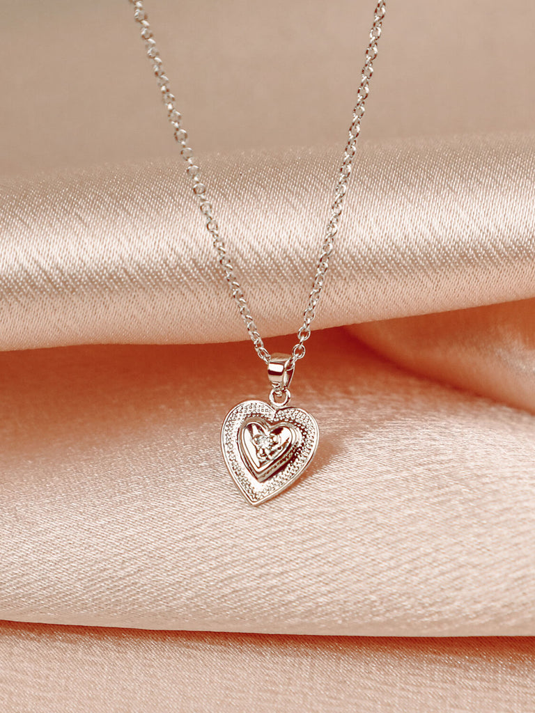 Close up of True Heart Necklace in 14k white gold with diamond in the center