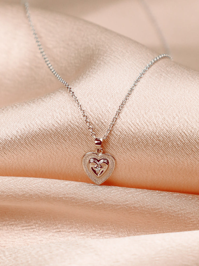 detail shot of true heart necklace with diamond in the center 