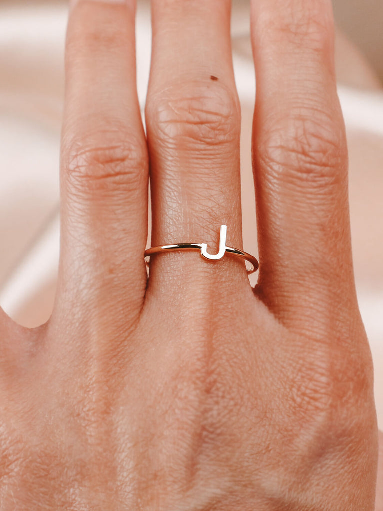 women's Block initial ring "J" in 14k yellow gold on hand