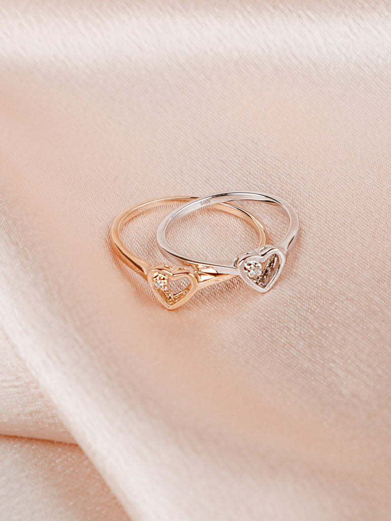 two women's Brilliant Diamond Heart rings in 14k Rose and white Gold 