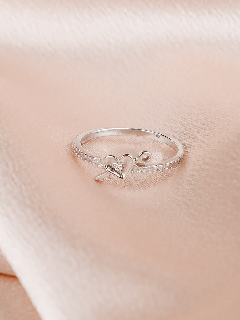 Detail photo of diamond love locked ring in 14k white gold