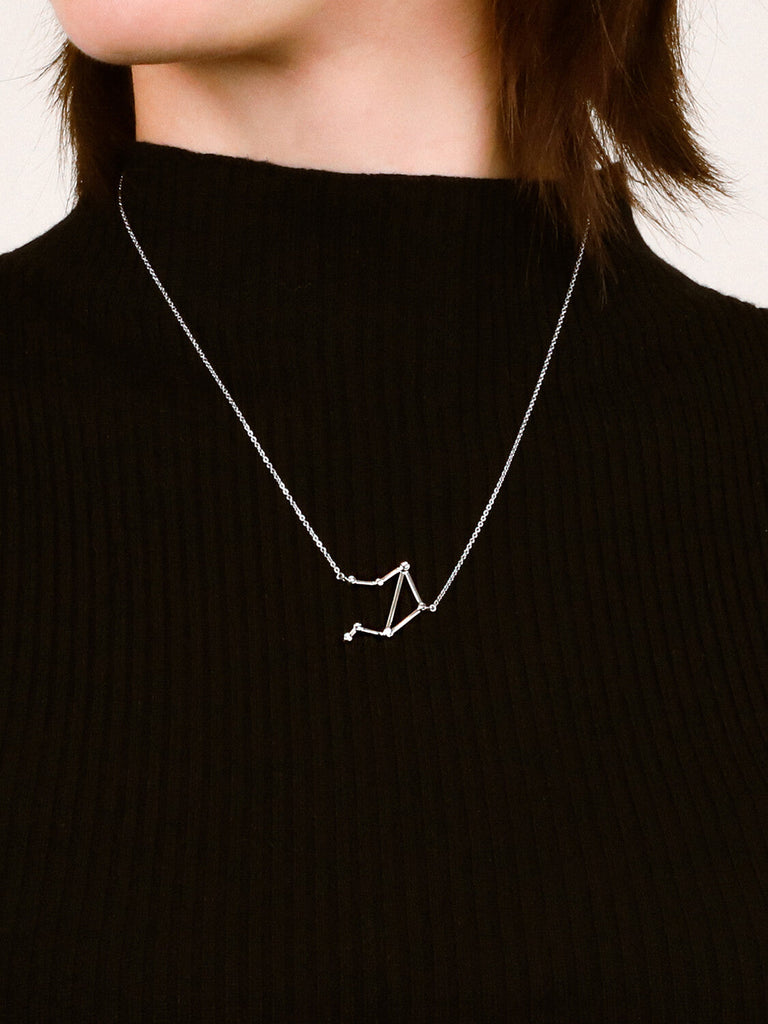 Sterling Silver Libra Constellation necklace on a female model's neckClose detail photo of sterling silver Leo zodiac constellation necklace from ModSet jewelry
