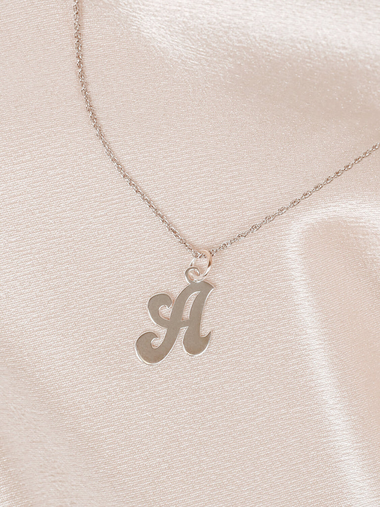 close up photo Sterling silver "A" pendant necklace on chain