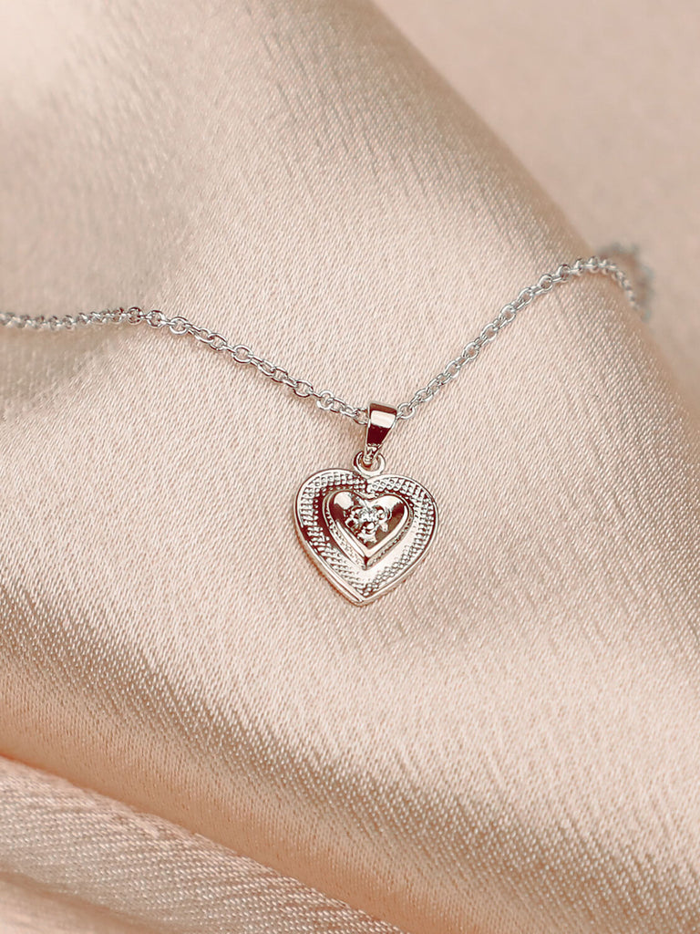 true heart necklace with diamond in the center in 14k  white gold
