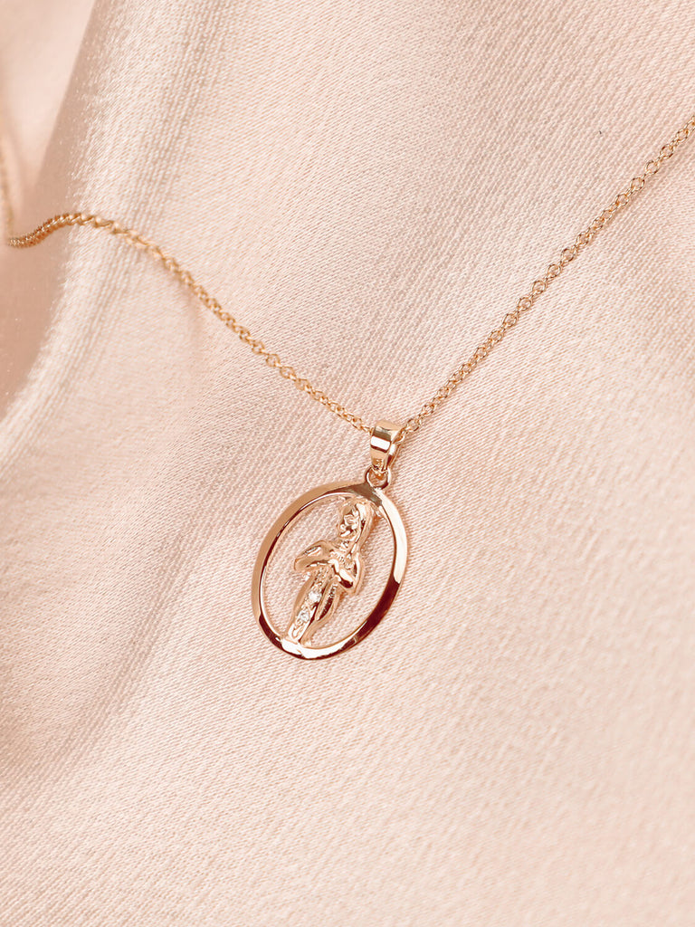 detail photo of virgo zodiac charm necklace with diamonds in 14k yellow gold