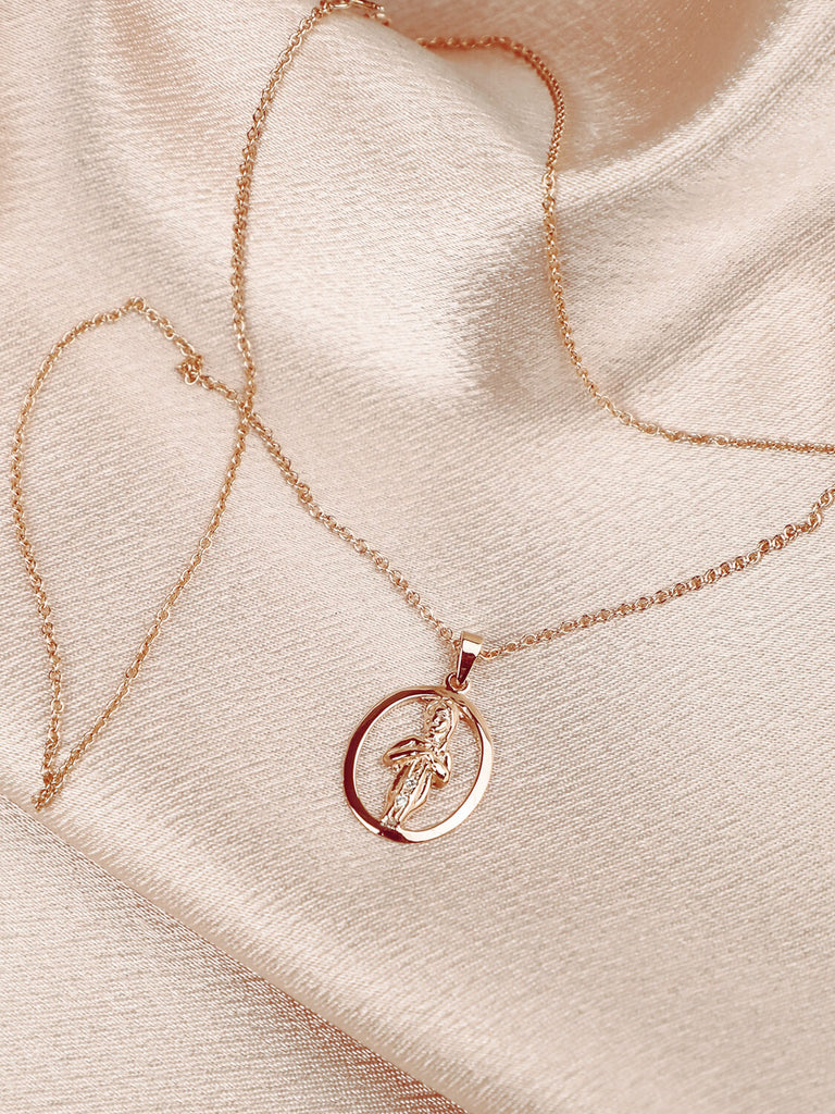 detail photo of virgo zodiac charm necklace with diamonds in 14k yellow gold